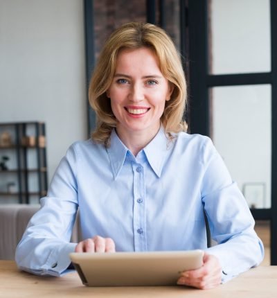joyful-business-woman-using-tablet-table-1-scaled.jpg